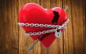 Locked heart against wooden table